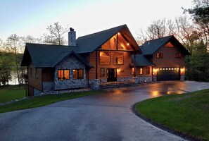 Huge front porch area with paved circle driveway and plenty of parking