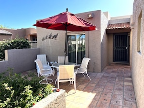 Patio seating within the front of home gate 