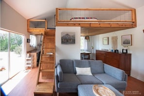 living room, stairs to loft area
