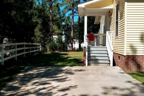 Concrete drive.  Steps to entering apartment
parking