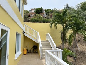 Stairs from driveway to apartment entrance