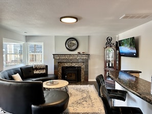 Second seating room with smart tv and wet bar