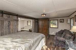 The wooden and stone walls complimenting the vintage styled cabinet.