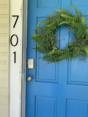Front door. You will use keypad to get in . Please do not lock bottom lock .