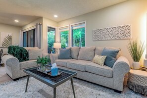 Beautiful modern living area with a view of the golf course.