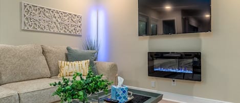 Kick back and enjoy the LED Fireplace (with or without heat) while watching your favorite movie on the 55" Roku TV