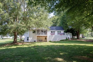 Large backyard with beautiful shade trees.