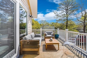 Outdoor deck with seating and dining plus grill (2nd floor)