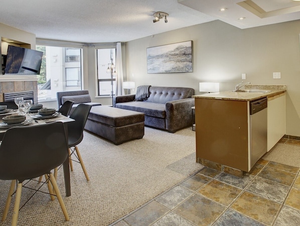 Living room, dining room and kitchen area