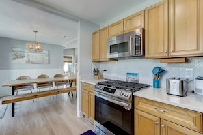 Updated Fully Equipped Galley Kitchen with Gas Stove and Stainless Appliances