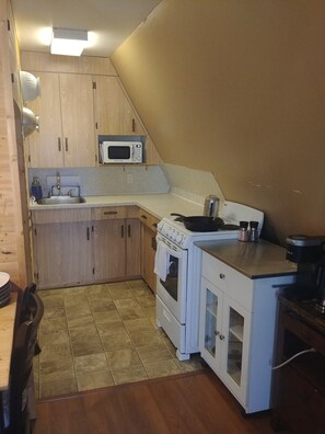 Fridge, stove, microwave, rice cooker, basic dishes and cookware. Keurig 
