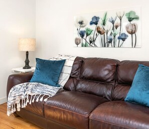 The main floor living room has the most comfortable couch, whether sitting or lying down to watch TV (or take a snooze).