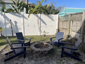 Outdoor fire pit with Adirondack chairs