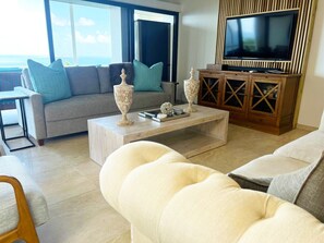 Experience the Charm of Our Well-Furnished Living Area, Complete with a Pull-Out Sleeper Sofa