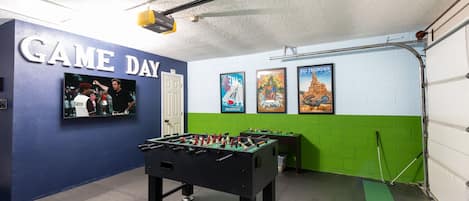 Game Room with Putting Green, Foosball Table, Smart Tv, Pool Toys, Lego Table, Giant Connect Four, and Classic Arcade Games including Golf Tee, Pacman, Galaga and many more!