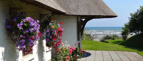 Thatcher's Rest Cottage with stunning sea views.