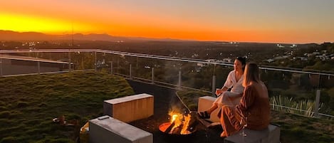 Cosy up by the beautiful, rooftop fire pit.