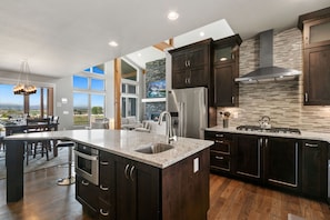 Chef's Kitchen | Stainless Steel Appliances and Large Kitchen Island