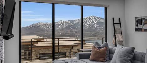 Enjoy incredible views from the couch in this comfortable and spacious living room area.