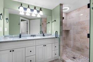 Master bathroom with a walk in shower.