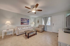 Living room with a pull out queen sofa.