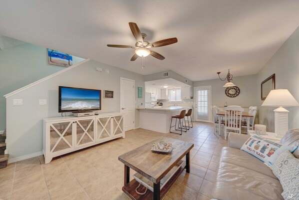 Living room with kitchen and dining area.