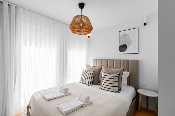 Experience tranquility in our queen-size bedroom flooded with natural light #bright #modern