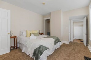 The first floor bedroom has a comfy queen bed.