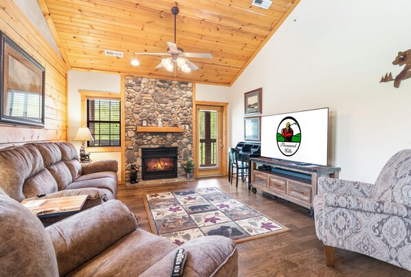 Living Room with Deck Access, Work Station Desk, Cable TV, and Seasonal Gas Fireplace