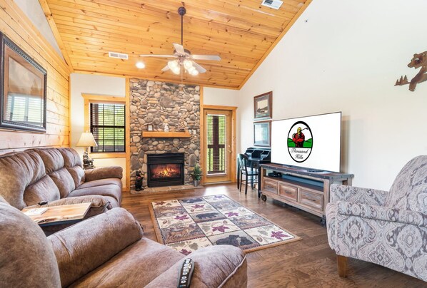 Living Room with Deck Access, Work Station Desk, Cable TV, and Seasonal Gas Fireplace