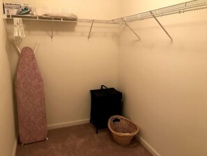 Primary bedroom walk in closet