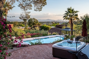 Hot tubbin' in paradise! This backyard oasis is calling your name!