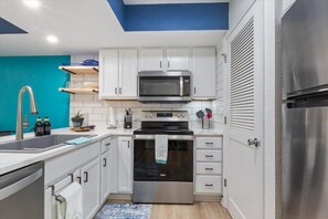 Stainless steel appliances & a laundry closet for your use