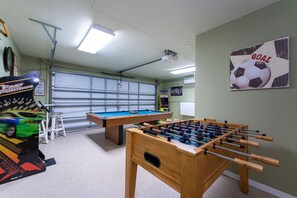 Game room with AC pool and foosball tables and arcades!