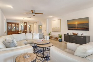 Living Room with sectional sofa.  Dining in background.