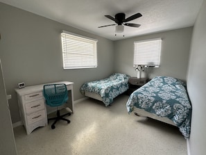 Bedroom 2 with two twin beds and desk