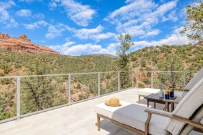 Sun loungers with mountain views.