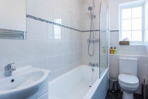 Full bathroom. Bath with overhead shower (rainforest and hand held)