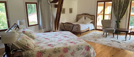 A very large high ceiling room with two balconies . 