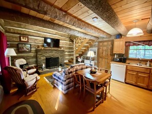 Living Room with Wood Burning Fireplace & Smart TV