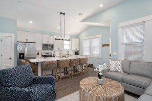 Beautiful open layout kitchen with island. Stone countertops and stainless appliances.
