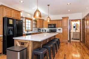 Ample space in the kitchen for the cook in the family or for group cooking. Island ideal for gathering or quick breakfast.