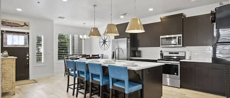 The spacious, modern kitchen offers fantastic amenities and ample seating options