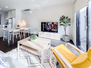 modernlounge and dining area seats 6 with high chair