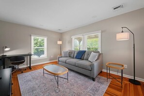Living Room with Pull Out Couch and Office Space