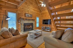 Living room with gas fireplace and Smart TV