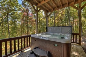 Relax in the hot tub and enjoy nature sounds from the woods