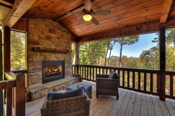 Outdoor wood burning fireplace on the deck