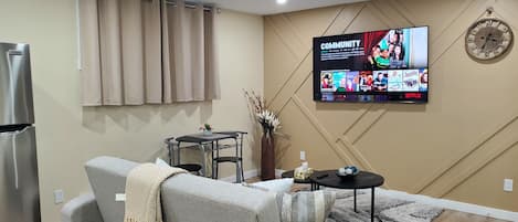 Living Room with 65" TV Entertainment; Netflix & Amazon Prime