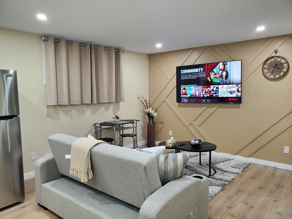Living Room with 65" TV Entertainment; Netflix & Amazon Prime
